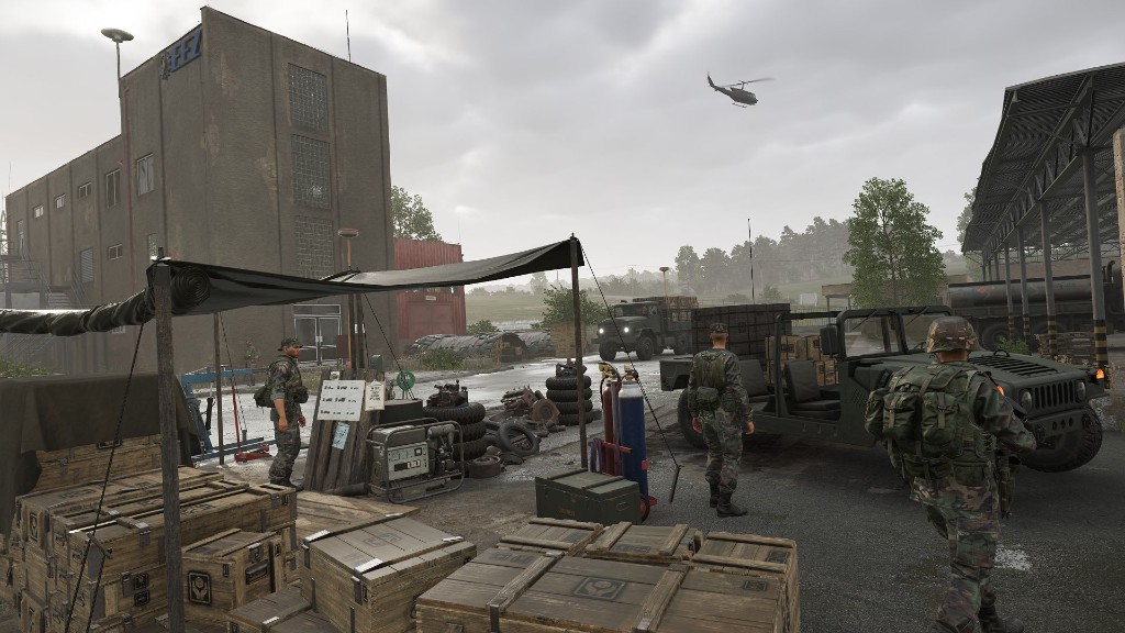 Base logistics yard with Humvee and crates