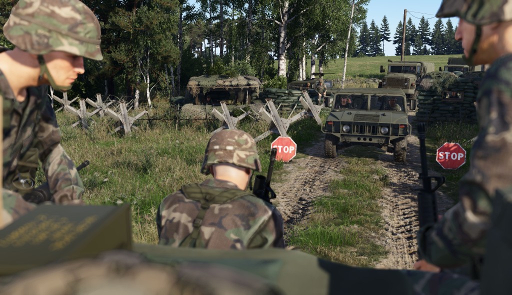 Military checkpoint with Humvee on a dirt road